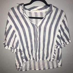 A blue and white striped flowy shirt